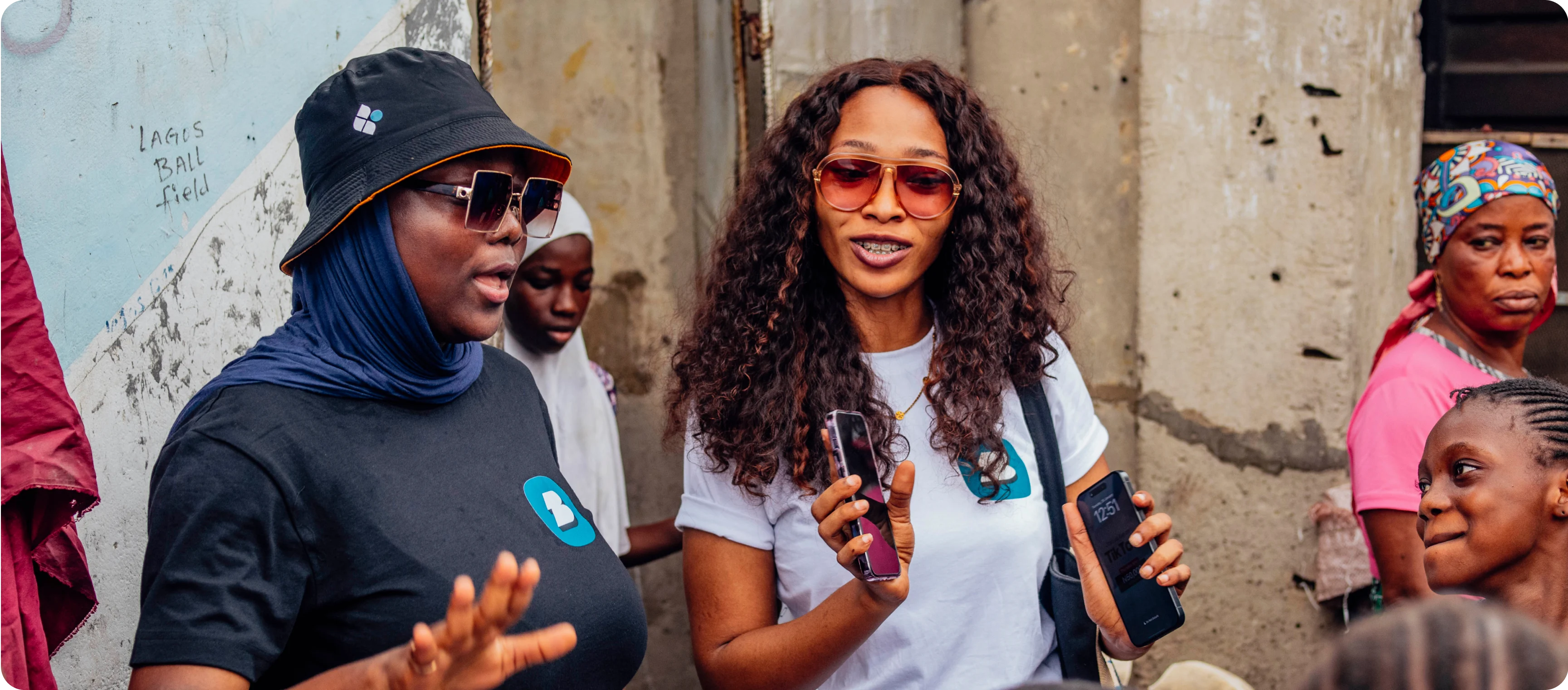 two ladies standing stand by side having a conversation